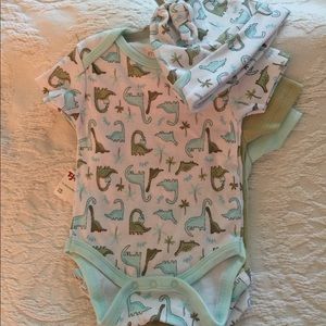 Kyle & Deen 0-3 months.Three (3) Onesies A Beanie.